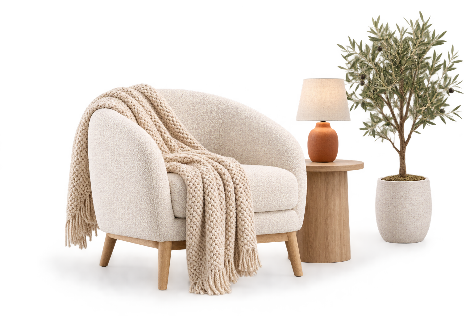 Boucle armchair with ceramic lamp and throw